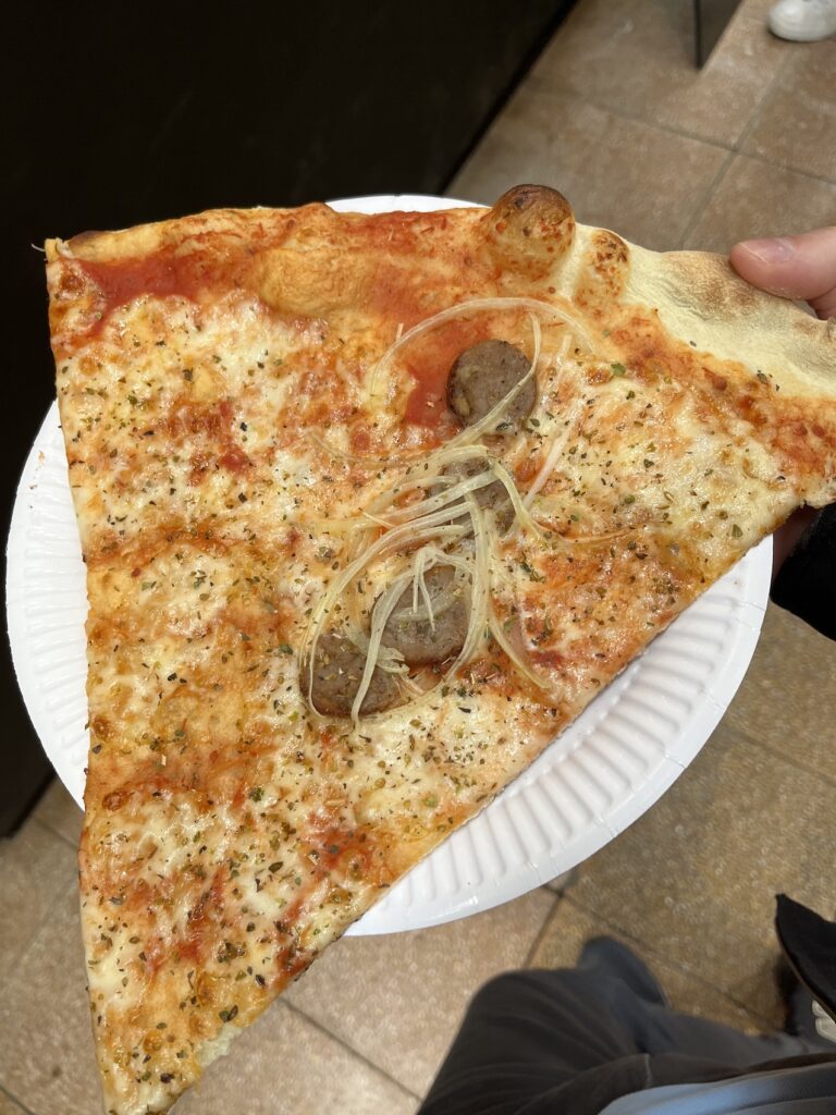 pizza by the slice sausage onion